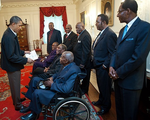 In 2011, President Barack Obama meets with former participants of the Strike.
